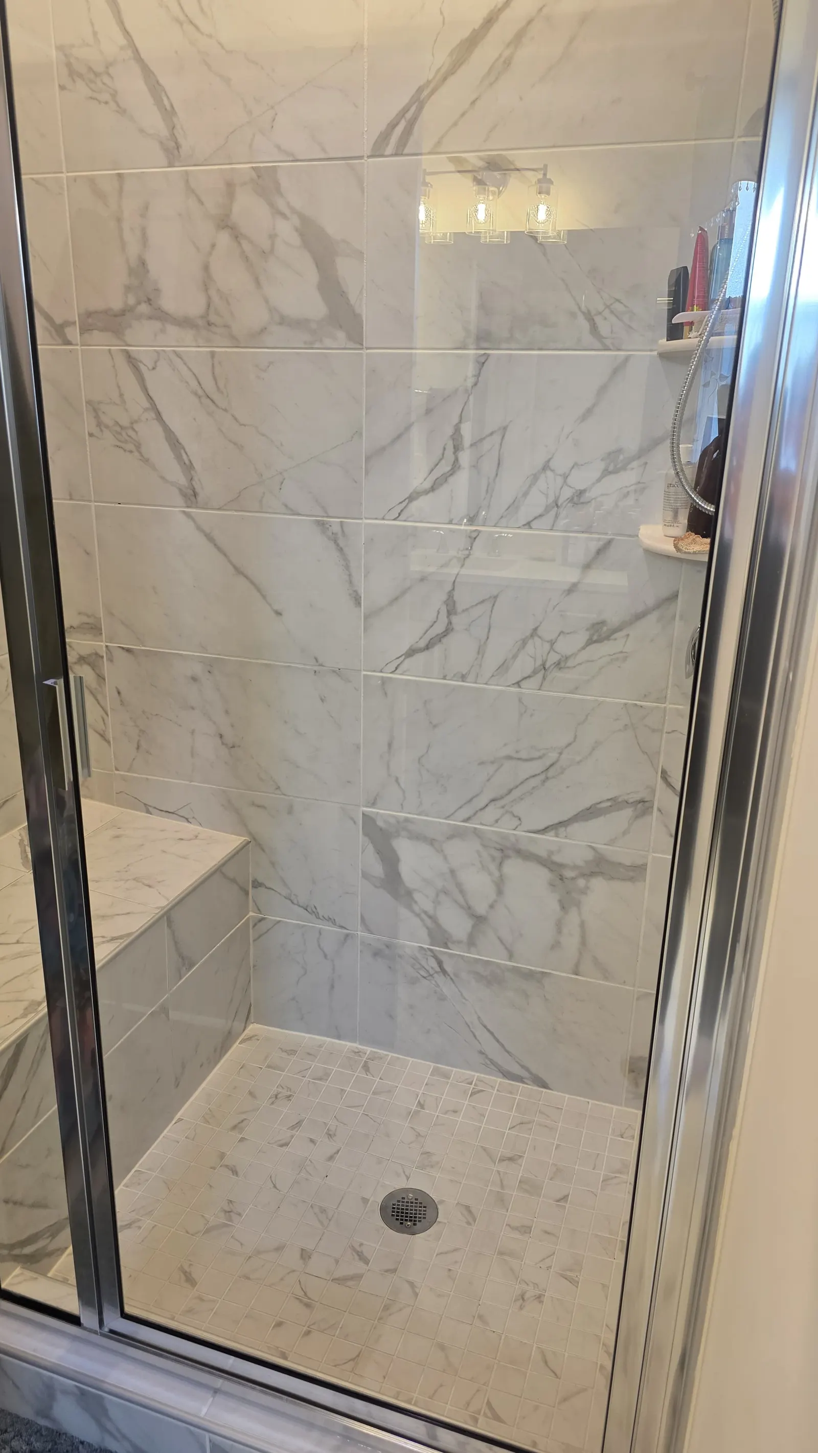 Spotless marble shower after a deep clean in a Willow Spring, NC home