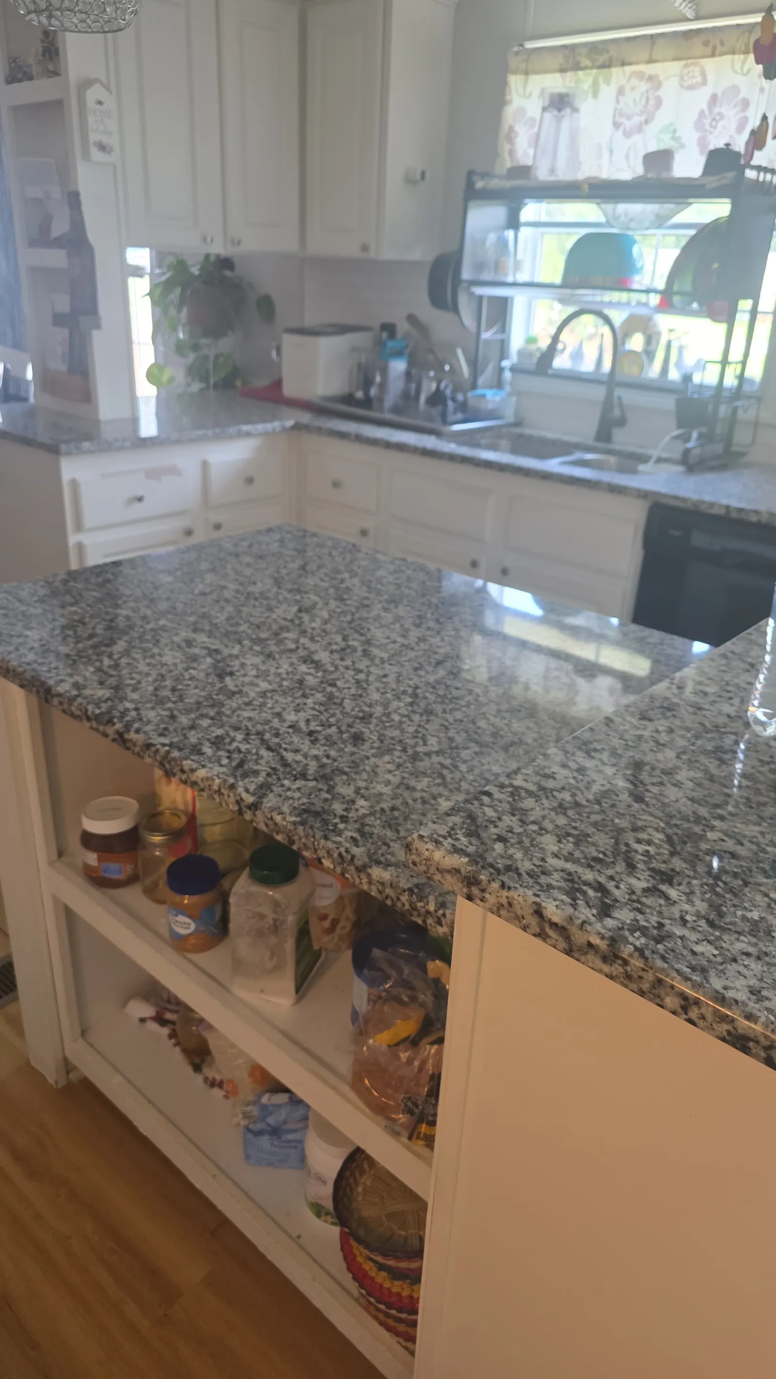 Clean organized kitchen island representing residential cleaning services